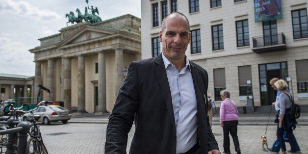 Greek Finance Minister Yanis Varoufakis walks across Pariser Platz in front of the landmark Brandenburger Gate as he shuttles between meetings in Berlin on June 8, 2015. The Greek finance minister met with several politicians including his German counterpart during his visit to Berlin. AFP PHOTO / ODD ANDERSEN (Photo credit should read ODD ANDERSEN/AFP/Getty Images)