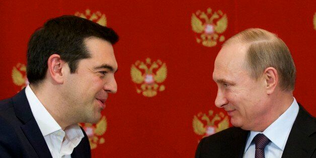 Russian President Vladimir Putin, right, and Greek Prime Minister Alexis Tsipras speak during a signing ceremony in the Kremlin in Moscow, Russia, Wednesday, April 8, 2015. Russian President Vladimir Putin said the leader of Greece did not ask for financial aid during an official visit, easing speculation that Athens might use its relations with Moscow to gain advantage in bailout talks with European creditors. (AP Photo/Alexander Zemlianichenko, Pool)
