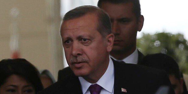 Turkish President Tayyip Erdogan looks on after arriving at Esenboga Airport, in Ankara, on June 8, 2015 after Erdogan's ruling party lost in the June 7 polls its absolute majority in parliament for the first time since coming to power in 2002, delivering a severe blow to President Recep Tayyip Erdogan's ambition to expand his powers. AFP PHOTO / ADEM ALTAN (Photo credit should read ADEM ALTAN/AFP/Getty Images)
