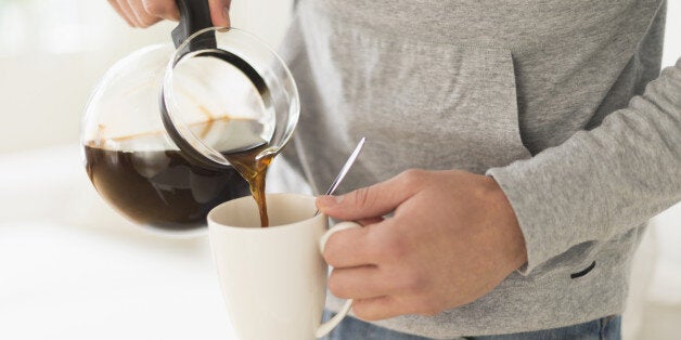 Young man pouring coffee, Jersey City, New Jersey, USA