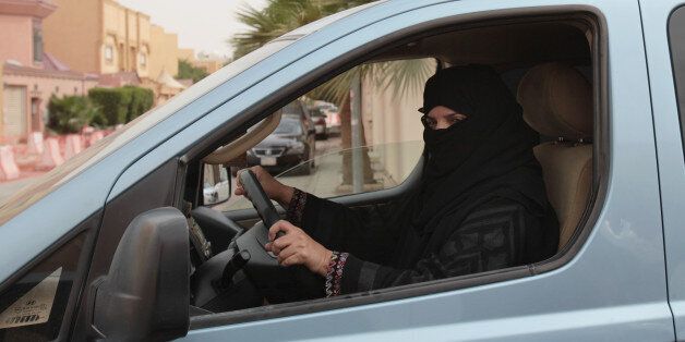 Aziza Yousef drives a car in Riyadh, Saudi Arabia, Saturday, March 29, 2014, as part of a campaign to defy Saudi Arabia's ban on women driving. In the six months since Saudi activists renewed calls to defy the kingdom's ban on female drivers, small numbers of women have gotten behind the wheel almost daily in what has become the country's longest such campaign. (AP Photo/Hasan Jamali)