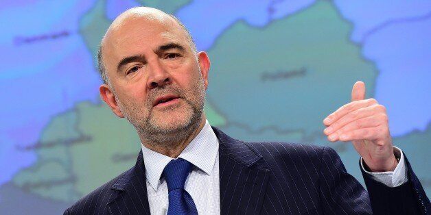 European Commissioner for Economic and Financial Affairs, Taxation and Customs Pierre Moscovici holds a press conference to announce the European Commission's Spring 2015 Economic Forecast, in Brussels, on May 5, 2015. AFP PHOTO/Emmanuel Dunand (Photo credit should read EMMANUEL DUNAND/AFP/Getty Images)