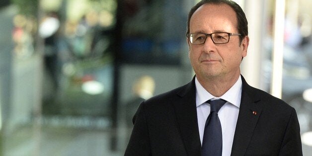 French President Francois Hollande looks on during the inauguration of the exhibition 'Les passagers du Grand Paris Express' (Passengers of the Grand Paris Express) on June 12, 2015 at the Val de Marne museum of contemporary art in Vitry sur Seine. AFP PHOTO / ALAIN JOCARD (Photo credit should read ALAIN JOCARD/AFP/Getty Images)