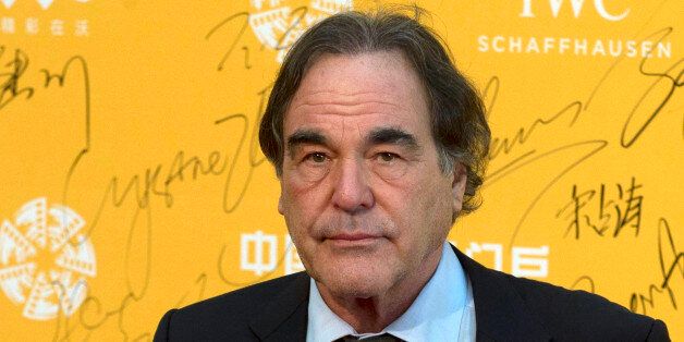 FILE - This April 16, 2014 file photo shows U.S director Oliver Stone at the 4th Beijing International Film Festival held in Beijing, China. Stone will write and direct a film about Edward Snowden, one of two high-profile films in the works about the National Security Agency leaker. Stone announced Monday, June 2, 2014, that he plans to adapt âThe Snowden Files: The Inside Story of the Worldâs Most Wanted Man,â a book by Guardian journalist Luke Harding. (AP Photo/Ng Han Guan, File)