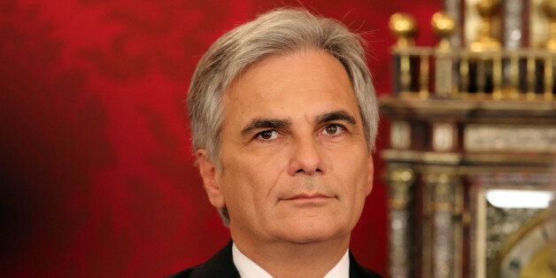 Austrian Chancellor Werner Faymann looks during the inauguration ceremony of the new grand coalition government at the Hofburg palace in in Vienna, Austria, Monday, Sept. 1, 2014. (AP Photo/Ronald Zak)