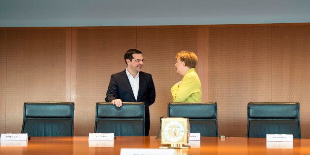 BERLIN, GERMANY - MARCH 23: In this photo provided by the German Government Press Office (BPA), German Chancellor Angela Merkel and Greek Prime Minister Alexis Tsipras talk at the start of their meeting at the Chancellery on March 23, 2015 in in Berlin, Germany. (Photo by Guido Bergmann-Bundesregierung via Getty Images)