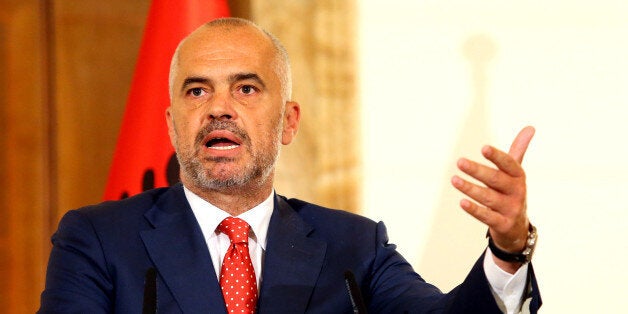 Albanian Prime Minister Edi Rama speaks at the news conference with visiting Serbian Prime Minister Aleksandar Vucic, the first Serbian leader to visit the nation after a troubled past, at the Palace of Brigades in capital Tirana, Wednesday, May 27, 2015. Both countries are trying to overcome their troubled past while working toward EU membership. Relations between the two Balkan states remain strained, mainly over the former Serbian province of Kosovo where majority ethnic Albanians declared independence in 2008 which Serbia refused to recognize. (AP Photo/Hektor Pustina)