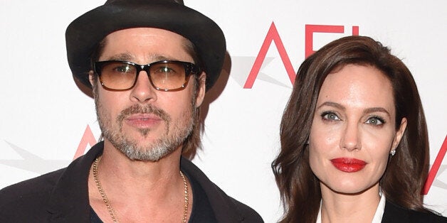 BEVERLY HILLS, CA - JANUARY 09: Actor Brad Pitt (L) and actress/director Angelina Jolie attend the 15th Annual AFI Awards at Four Seasons Hotel Los Angeles at Beverly Hills on January 9, 2015 in Beverly Hills, California. (Photo by Jason Merritt/Getty Images)