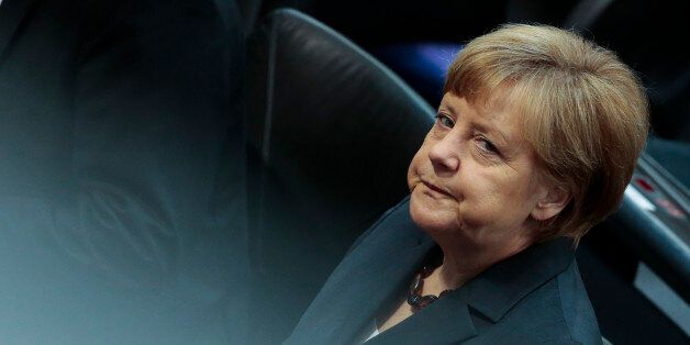 German Chancellor Angela Merkel attends a special commemoration session of German parliament Bundestag to remember the end of World War II at the Reichstag building in Berlin, Germany, Friday, May 8, 2015.(AP Photo/Markus Schreiber)