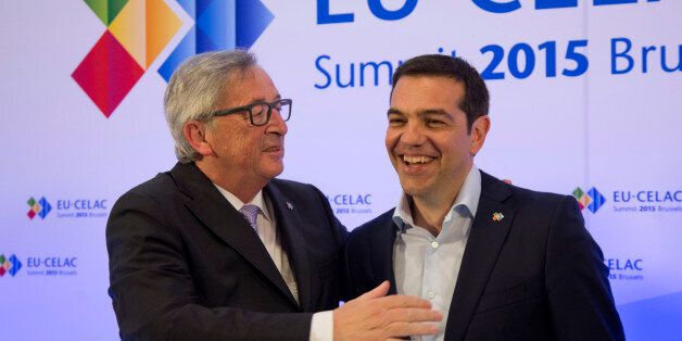 European Commission President Jean-Claude Juncker, left, welcomes Greek Prime Minister Alexis Tsipras during arrivals for the EU-CELAC summit in Brussels on Wednesday, June 10, 2015. European leaders and their Latin America and the Caribbean counterparts meet on a biannual basis in an effort to maintain international and economic ties. (AP Photo/Virginia Mayo, Pool)