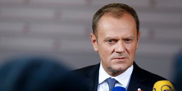 European Council President Donald Tusk speaks with the media as he arrives for a formal dinner at the Eastern Partnership summit in Riga, on Thursday, May 21, 2015. EU leaders on Thursday will seek new ways to bolster ties with six post-communist nations in Eastern Europe, a year and a half after a previous summit of the Eastern Partnership ended with a fateful standoff over Ukraine. (AP Photo/Mindaugas Kulbis)