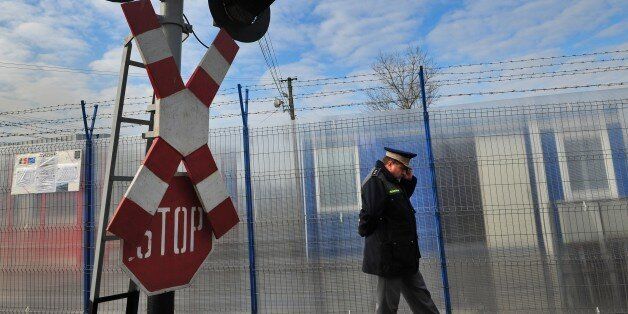 A Romanian border police oficer inspects the Ungheni train station at the border with Moldova on January 18, 2011. Romanian border police is tightening controls at the border with Moldova in order to fulfill requirements to enter the border-free Schengen zone in March 2011, but France and Germany have publicly opposed such a move. Bucharest insists that formerly Schengen enlargements were made only on the basis of technical criteria like the implementation of a secure border control system and warns against an 'unfair change of the rules'. AFP PHOTO / DANIEL MIHAILESCU (Photo credit should read DANIEL MIHAILESCU/AFP/Getty Images)