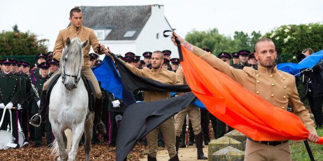 Actors play a symbolic scene during the official Belgian ceremony to commemorate the bicentenary of the battle of Waterloo at the Lion's Mound in Braine-l'Alleud, near Waterloo, Belgium on Thursday, June 18, 2015. (AP Photo/Geert Vanden Wijngaert, Pool)