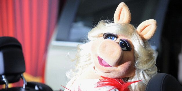Miss Piggy arrives at the premiere of The Muppets at El Capitan Theater, Saturday, Nov. 12, 2011, in Los Angeles. The Muppets opens in theaters Nov. 23, 2011. (AP Photo/Katy Winn)