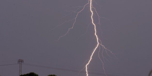 A lightning is seen on June 11, 2014 over Schkeuditz, Germany. AFP PHOTO / HENDRIK SCHMIDT (Photo credit should read HENDRIK SCHMIDT/AFP/Getty Images)