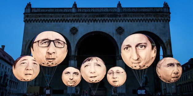 MUNICH, GERMANY - JUNE 5: Activists have installed balloons decorated with the portraits of (L-R) Japanese Prime Minister Shinzo Abe, French President Francois Hollande, Italian Prime Minister Matteo Renzi, German Chancellor Angela Merkel, Canadian Prime Minister Stephen Harper, British Prime Minister David Cameron and US President Barack Obama during a protest activity against the G7 summit on June 5, 2015 in Munich, Germany. Germany will host the G7 summit at Elmau Castle near Garmisch Partenkirchen, southern Germany on June 7 and 8, 2015. (Photo by Joerg Koch/Getty Images)