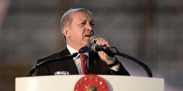 ISTANBUL, TURKEY - MAY 30: Turkey's President Tayyip Erdogan addresses his supporters during a ceremony to mark the 562nd anniversary of the conquest of the city by Ottoman Turks on May 30, 2015 in Istanbul, Turkey. Erdogan has reportedly been criticized by the opposition parties for campaigning in favor of the ruling Justice and Development Party (AKP), a party he co-founded, even though as head of state the constitution bars him from party politics. Turkey will hold a general election on June 7, 2015 to elect the 550 members of the Grand National Assembly. (Photo by Gokhan Tan/Getty Images)