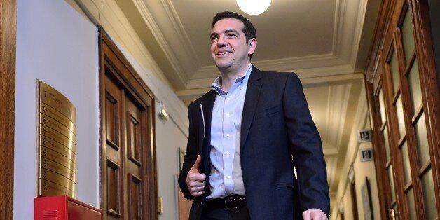 Greek Prime Minister Alexis Tsipras arrives for a cabinet meeting at the Greek parliament in Athens on April 30, 2015. Greece resumed talks with its international creditors on critically-needed bailout funds as officials warned that time was running out for a deal. AFP PHOTO / LOUISA GOULIAMAKI (Photo credit should read LOUISA GOULIAMAKI/AFP/Getty Images)