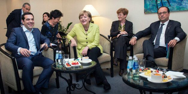 RIGA, LATVIA - MAY 21: In this handout photo provided by the German Government Press Office (BPA), (L-R) German Chancellor Angela Merkel, Greek Prime Minister Alexis Tsipras and French President Francois Hollande at the beginning of their meeting at the sidelines of the EU summit The Eastern Partnership on May 21, 2015 in Riga, Latvia. (Photo by Guido Bergmann/Bundesregierung via Getty Images)