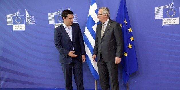 Prime Minister of Greece Alexis Tsipras (L) stands next to European Union Commission President Jean-Claude Juncker prior to their meeting at the European Union Commission headquarter in Brussels, on June 3, 2015. Greek Prime Minister Alexis Tsipras heads for last-ditch talks with European Commission chief Jean-Claude Juncker in Brussels to seal a desperately-needed bailout deal despite pessimism from hardline Germany. AFP PHOTO / THIERRY CHARLIER (Photo credit should read THIERRY CHARLIER/AFP/Getty Images)