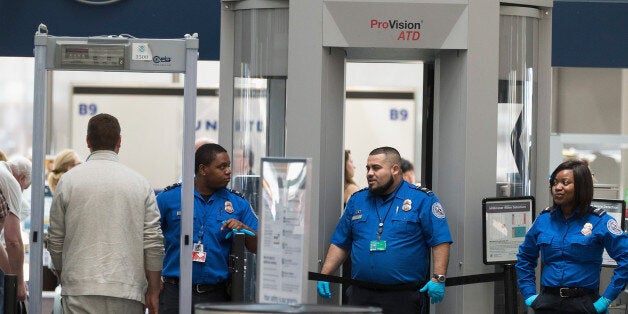 CHICAGO, IL - JUNE 02: Travelers are screened by Transportation Security Administration (TSA) workers at a security check point at O'Hare Airport on June 2, 2015 in Chicago, Illinois. The Department of Homeland Security said that the acting head of the TSA would be replaced following a report that airport screeners failed to detect explosives and weapons in nearly all of the tests that an undercover team conducted at airports around the country. (Photo by Scott Olson/Getty Images)