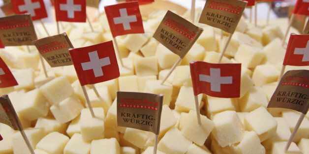 BERLIN, GERMANY - JANUARY 21: Swiss flags stick out of cubes ofAppenzeller Swiss cheese at a stand at the 2011 Gruene Woche agricultural trade fair at Messe Berlin on January 21, 2011 in Berlin, Germany. The trade fair comes on the heels of a dioxon scandal in Germany that led to the recent quarantine of approximately 6,000 farms. The Gruene Woche will be open to the public from January 21 through 30. (Photo by Sean Gallup/Getty Images)