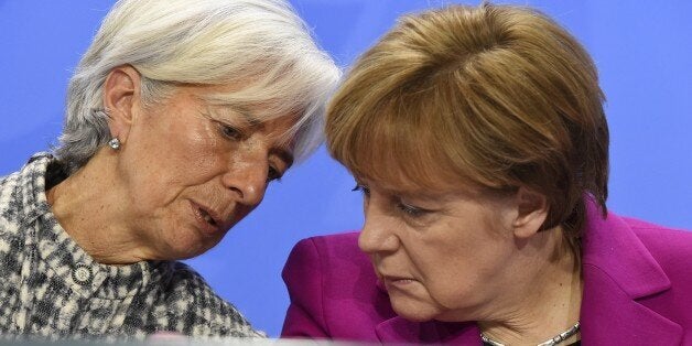 (From L) International Monetary Fund Managing Director Christine Lagarde and German Chancellor Angela Merkel address a press conference after talks at the chancellery in Berlin on March 11, 2015. AFP PHOTO / TOBIAS SCHWARZ (Photo credit should read TOBIAS SCHWARZ/AFP/Getty Images)