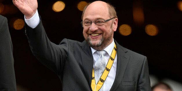 European parliament president Martin Schulz waves after he received the International Charlemagne Prize of Aachen (Karlspreis) in Aachen, Germany, Thursday, May 14, 2015. The International prestigious Charlemagne Prize of Aachen is the oldest and best-known prize awarded for work done in the service of European unification. (AP Photo/Martin Meissner)