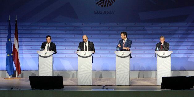 From left: President of the ECB, Mario Draghi, Commissioner for Economic and Financial Affairs, Taxation and Customs, Pierre Moscovici, Eurogroup president Jeroen Dijsselbloem, and Managing Director of the European Stability Mechanism, Klaus Regling participate in an Informal Meeting of Ministers for Economic and Financial Affairs of the European UnionRiga, Latvia on Friday, April 24, 2015. Greece's finance minister came under fire Friday from his peers in the 19-country eurozone for failing to come up with a comprehensive list of economic reforms that are needed if the country is to get vital loans to avoid going bankrupt. (Dmitris Sulzics/F64 Photo Agency via AP)