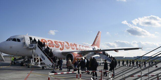 People board an Easy Jet plane on March 17, 2015 at the Toulouse-Blagnac airport in the southwestern French city. AFP PHOTO / PASCAL PAVANI . (Photo credit should read PASCAL PAVANI/AFP/Getty Images)