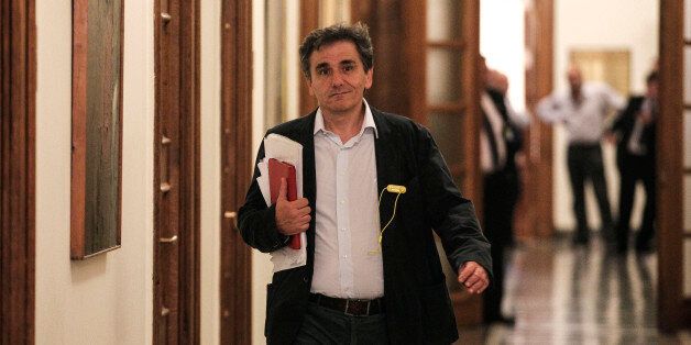 Euclid Tsakalotos, Greece's Deputy Foreign Minister for international economic relations arrives for a cabinet meeting at the parliament in Athens, Greece, on Thursday, April 30, 2015. Greeceâs started a new round of talks with bailout negotiators Thursday, insisting it was not ready to make key concessions despite a major looming debt repayment. (AP Photo/Yorgos Karahalis)