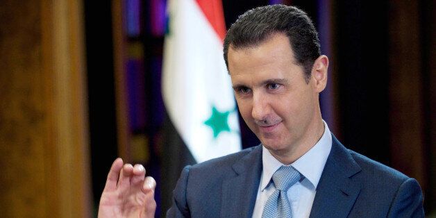 FILE - In this Tuesday, Feb. 10, 2015 file photo released by the Syrian official news agency SANA, Syrian President Bashar Assad gestures during an interview with the BBC, in Damascus, Syria. (AP Photo/SANA, File)