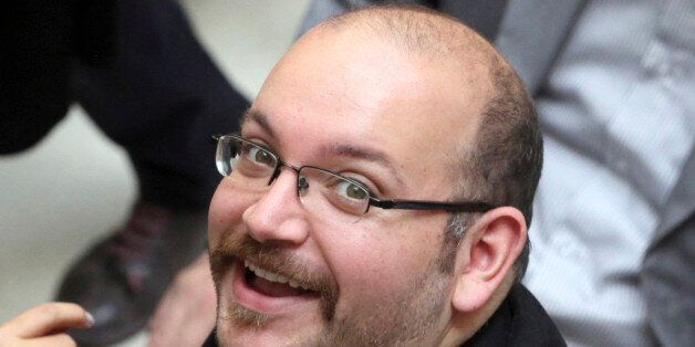FILE - In this photo April 11, 2013 file photo, Jason Rezaian, an Iranian-American correspondent for the Washington Post, smiles as he attends a presidential campaign of President Hassan Rouhani in Tehran, Iran. Lawyer Leila Ahsan, who represents Rezaian, told the Post on Monday, April 20, 2015 that the correspondent also faces charges of