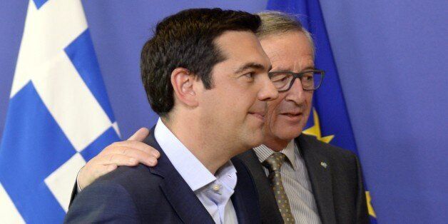 Prime Minister of Greece Alexis Tsipras (L) walks with European Union Commission President Jean-Claude Juncker prior to their meeting at the European Union Commission headquarter in Brussels, on June 3, 2015. Greek Prime Minister Alexis Tsipras heads for last-ditch talks with European Commission chief Jean-Claude Juncker in Brussels to seal a desperately-needed bailout deal despite pessimism from hardline Germany. AFP PHOTO / THIERRY CHARLIER (Photo credit should read THIERRY CHARLIER/AFP/Getty Images)