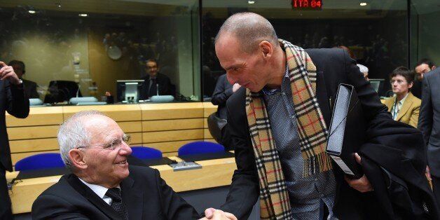 Greek Finance minister Yanis Varoufakis (R) shakes hands with German Finance Minister Wolfgang Schauble during an emergency Eurogroup finance ministers meeting at the European Council in Brussels on February 11, 2015. Proposals by the new government in Athens to renegotiate the terms of its massive international bailout are scheduled to be discussed by eurozone finance ministers in Brussels on February 11 and 12. AFP PHOTO / EMMANUEL DUNAND (Photo credit should read EMMANUEL DUNAND/AFP/Getty Images)