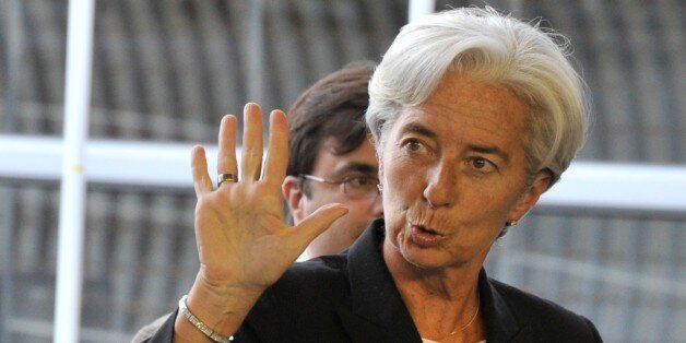 French Finance Minister Christine Lagarde waves as she arrives prior to an Eurogroup meeting on June 19, 2011 at the EU Headquarters in Luxembourg. Lagarde attends a two days of crunch talks to release funds to keep Athens from default in the summer, while mulling the shape of a second bailout for Athens in just over a year. Ministers from the 17 nations using the euro were to begin talks at 7:00 pm (1700 GMT) to approve loans of over 8.7 billion euros ($12.5 billion), their share of a 12-billion-euro tranche of bailout funding which Athens needs to avoid default next month. AFP PHOTO/ GEORGES GOBET (Photo credit should read GEORGES GOBET/AFP/Getty Images)