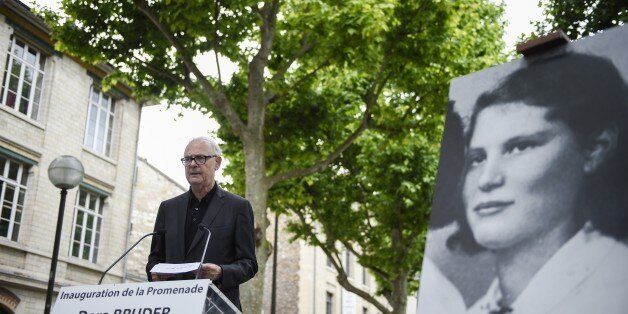 French literature nobel prize writer Patrick Modiano delivers a speech during the inauguration of the street 'Promenade Dora Bruder' on June 1, 2015 in Paris. Dora Bruder was a French Jewish woman who died in the Nazi death camp Auschwitz. AFP PHOTO / MARTIN BUREAU (Photo credit should read MARTIN BUREAU/AFP/Getty Images)