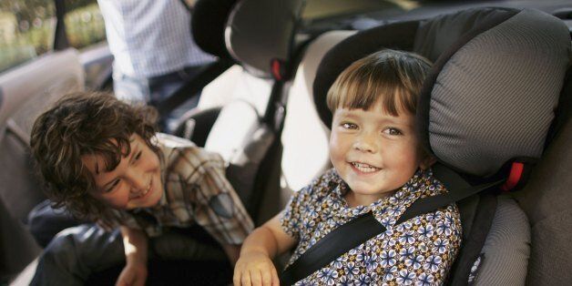 BRIGHTON, UNITED KINGDOM - SEPTEMBER 17: Charlie and Harry Woodhouse sit in their new child seats on September 17, 2006 in Brighton, England. Child car seats will become compulsory from tomorrow for all children up to the age of 12. Breaking of the new law could lead to a maximum fine of 500 GBP if convicted in court. (Photo by Bruno Vincent/Getty Images)