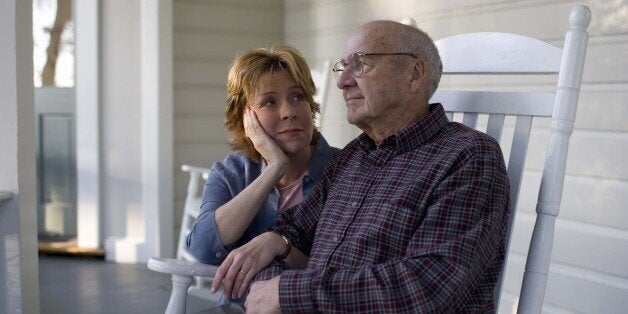 Woman sitting with father