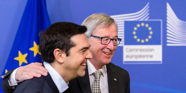 European Commission President Jean-Claude Juncker, right, welcomes Greece's Prime Minister Alexis Tsipras upon his arrival at the European Commission headquarters in Brussels Friday, March 13, 2015. (AP Photo/Geert Vanden Wijngaert)