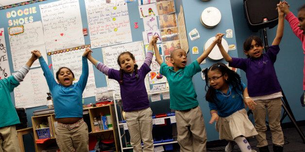 In this April 13, 2011 photo, children take part in a music class at the Mott Haven Academy Charter School, in the Bronx borough of New York. The school is trying to chart a course for others nationwide with a program designed to give foster children better odds at a good future. The school is sponsored by a citywide private child welfare agency, the New York Foundling. Foundling Executive Director Bill Baccaglini says the Foundlingâs Bronx Community Services shares the building with the school. Thus, there are always more than 200 counselors on call to help students individually. (AP Photo/Mary Altaffer)