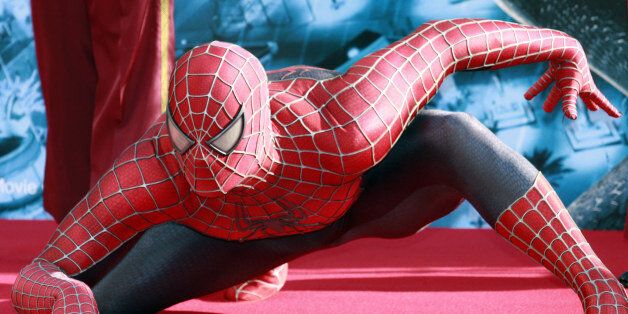 A man dressed as Marvel comics hero Spiderman poses for the press at the Hollywood theme park Universal Studios Japan, which has an attraction titled the 'Amazing Adventure of Spiderman: the ride', in Osaka, 13 April 2007. Hollywood actress Kirsten Dunst, starring in the latest Spiderman movie as the girlfriend of the super-hero, was paying a visit at the park as part of her trip in Japan for the world premiere of the new movie 'Spiderman 3'. AFP PHOTO / Yoshikazu TSUNO (Photo credit should r
