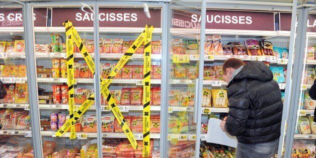 Tape is stuck across a cold fridge selling packets of meat at a super market in Quimper, western of France on February 7, 2015, to make customers aware about the origin of the meat they are buying, as consumers are growing more and more concerned with the origin and the fabrication process of what they eat. AFP PHOTO FRED TANNEAU (Photo credit should read FRED TANNEAU/AFP/Getty Images)