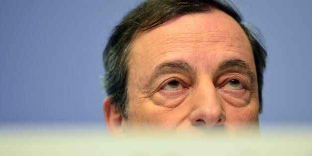 FRANKFURT AM MAIN, GERMANY - DECEMBER 04: Mario Draghi, President of the European Central Bank pictured during his first press conference following the monthly ECB board meeting in the new ECB headquaters on December 4, 2014 in Frankfurt am Main, Germany. ECB employees have moved into their new offices in recent months and the ECB has announced it will celebrate the building's official inauguration in 2015. (Photo by Thomas Lohnes/Getty Images)