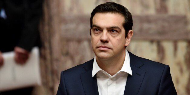 Greek Prime Minister Alexis Tsipras looks on during the swearing in ceremony of the New Greek President Prokopis Pavlopoulos (Unseen) in the parliament in Athens on March 13, 2015. AFP PHOTO / POOL / ARIS MESSINIS (Photo credit should read ARIS MESSINIS/AFP/Getty Images)