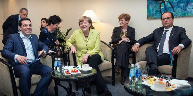 In this photo provided by German government Greek Prime Minister Alexis Tsipras, German Chancellor Angela Merkel, and French President Francois Hollande, from left, smile as they pose for a photograph at the beginning of their meeting at the sidelines of the Eastern Partnership summit in Riga, on Thursday, May 21, 2015. (Guido Bergmann/Bundesregierung via AP)