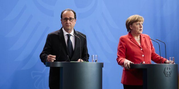 German Chancellor Angela Merkel, right, and French President Francois Hollande brief the media after a meeting at the chancellery, in Berlin, Germany, Tuesday, May 19, 2015. (AP Photo/Markus Schreiber)