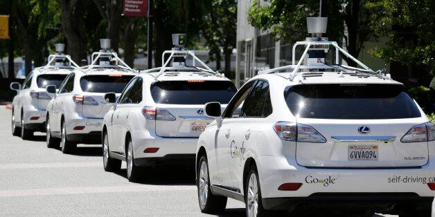 FILE - This file photo taken Tuesday, May 13, 2014 shows a row of Google self-driving cars outside the Computer History Museum in Mountain View, Calif. California's Department of Motor Vehicles will miss a year-end deadline to adopt new rules for cars of the future because regulators first have to figure out how they'll know whether