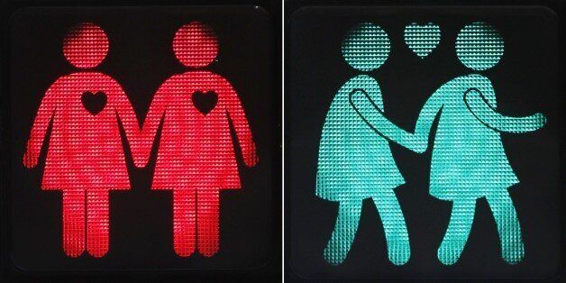 A combination of pictures taken on May 12, 2015 shows new traffic lights showing female same-sex couples in Vienna. On the occasion of the upcoming Life Ball, the Eurovision Song Contest and the Rainbow Parade in Vienna, the Austrian capital with its new traffic lights wants to promote tolerance and raise awareness to better road safety. AFP PHOTO / DIETER NAGL (Photo credit should read DIETER NAGL/AFP/Getty Images)