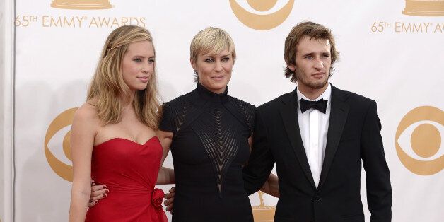 LOS ANGELES, CA - SEPTEMBER 22: Actress Robin Wright (C) with children Dylan Penn (L) and Hopper Penn (R) arrive at the 65th Annual Primetime Emmy Awards held at Nokia Theatre L.A. Live on September 22, 2013 in Los Angeles, California. (Photo by Kevork Djansezian/Getty Images)